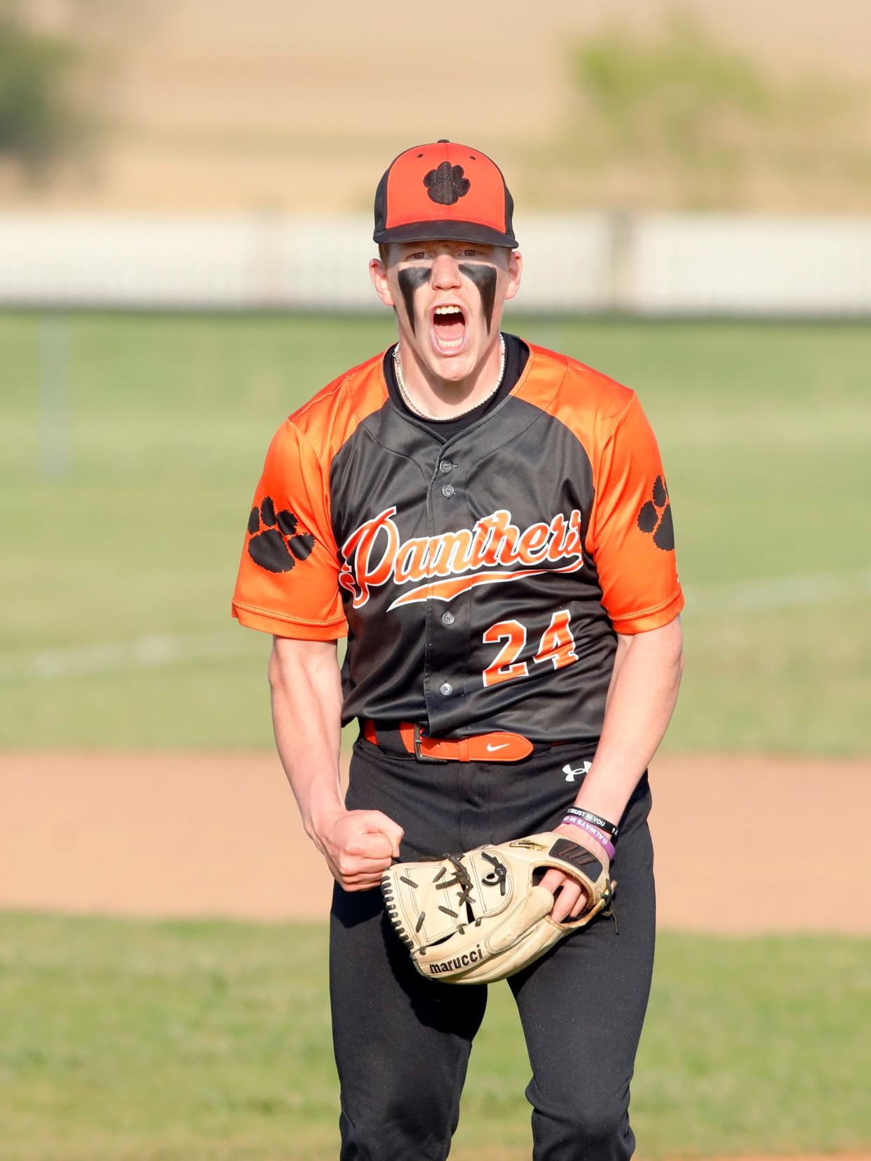 New Lexington pitcher Garrett Blosser celebrates after striking out the final batter he faced in a 5-4 win against host Sheridan on Wednesday in Thornville. Blosser pitched 2 1/3 scoreless innings to secure the save as the Panthers won their seventh straight game.