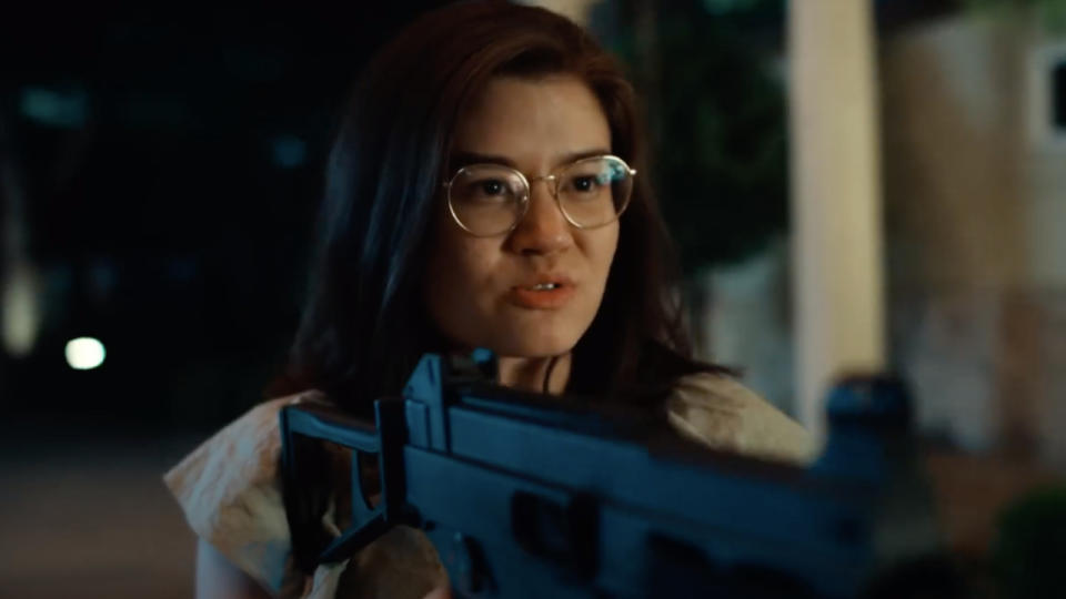 Kimi Rutledge holding a gun in trailer for Netflix's Obliterated