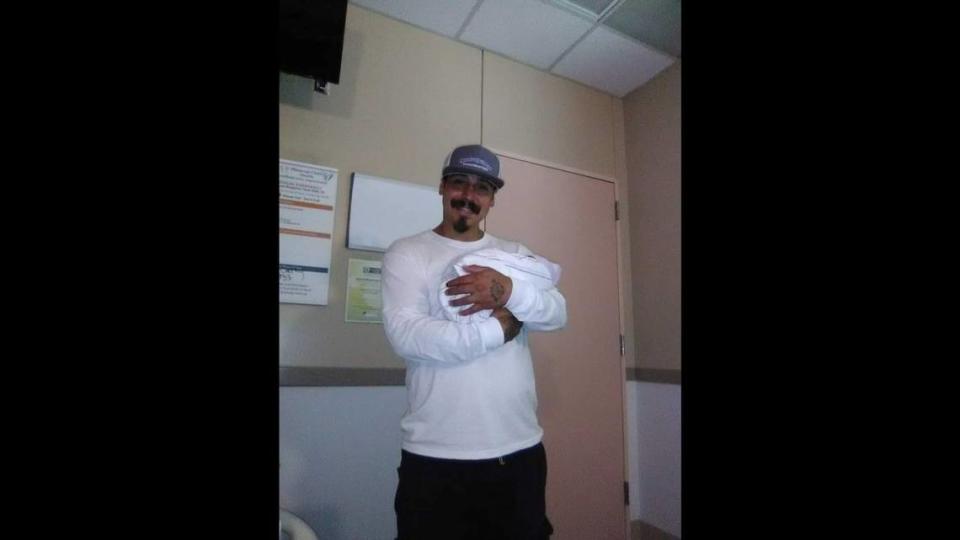 Joel Villegas holding son Devon in a photo from 2016. Villegas was killed by Tulare police on April 16, 2023. His family has filed a claim for damages.