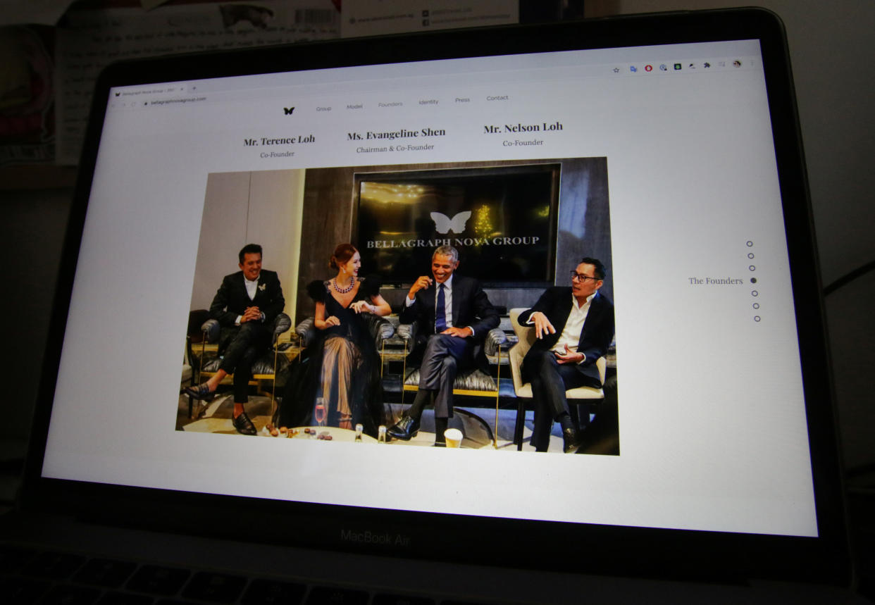 A photo on the website of Bellagraph Nova Group, showing owners Terence (R) and Nelson (L) Loh and Evangeline Shen sitting next to former US President Barack Obama, is pictured on screen.