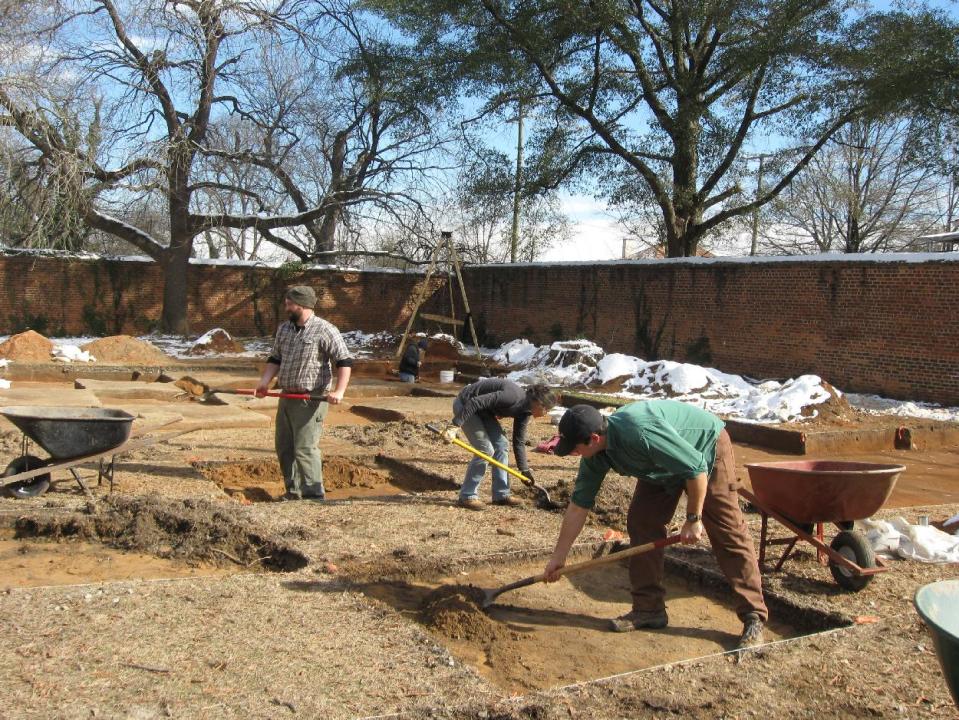 In this Jan. 30, 2014 photo, In this Jan. 30, 2014 photo, crews excavate the site of “Camp Asylum,” the Civil War-era prison that once held 1,500 Union officers on the grounds of the state mental hospital in Columbia, S.C., in the waning days of the Civil War. Racing against time, South Carolina archeologists are digging to uncover the remnants of a Civil War-era prisoner-of-war camp before the site in downtown Columbia is cleared to make room for a mixed-use development. (AP Photo/Susanne Schafer)