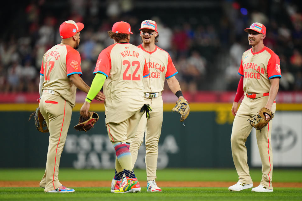 ARLINGTON, TX - JULY 16: Bobby Witt Jr. #7 of the Kansas City Royals and Jordan Westburg #11 of the Baltimore Orioles celebrate with teammates after winning during the 94th MLB All-Star Game presented by Mastercard at Globe Life Field on Tuesday, July 16, 2024 in Arlington, Texas. (Photo by Daniel Shirey/MLB Photos via Getty Images)