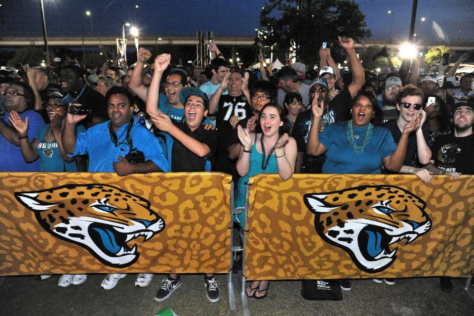 Jaguars fans cheer the first round choice of Central Florida's Blake Bortles by the Jacksonville Jaguars at the 2014 NFL Draft Party at EverBank Field on Thursday May 8, 2014, in Jacksonville, Fla. (AP Photo/Florida Times-Union/Bruce Lipsky)