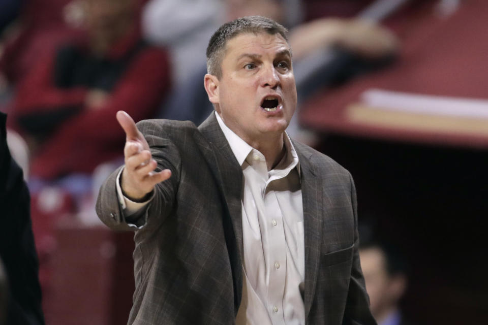 FILE - Boston College head coach Jim Christian argues a call during the first half of an NCAA men's college basketball game against Notre Dame in Boston, in this Wednesday, Feb. 26, 2020, file photo. Boston College fired basketball coach Jim Christian on Monday, Feb. 15, 2021, with three weeks left in his seventh season. Assistant Scott Spinelli will serve as interim head coach for the rest of the season. (AP Photo/Charles Krupa, File)