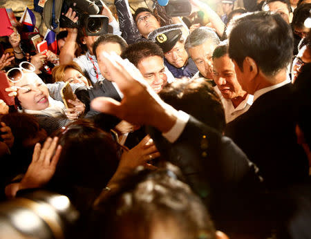 Philippine President Rodrigo Duterte (R) meets his supporters outside a hotel in Tokyo, Japan October 25, 2016. REUTERS/Kim Kyung-Hoon