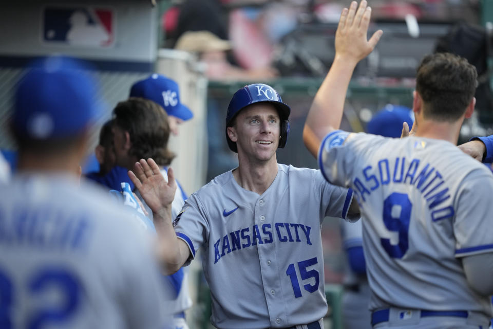 Kansas City Royals second baseman Matt Duffy (15) celebrates in the dugout after scoring off of a triple by MJ Melendez during the fourth inning of a baseball game against the Los Angeles Angels in Anaheim, Calif., Saturday, April 22, 2023. (AP Photo/Ashley Landis)