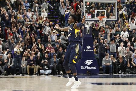 Dec 8, 2017; Indianapolis, IN, USA; Indiana Pacers guard Victor Oladipo (4) celebrates after scoring the game winning shot in the final minute of the fourth quarter against the Cleveland Cavaliers at Bankers Life Fieldhouse. Mandatory Credit: Brian Spurlock-USA TODAY Sports