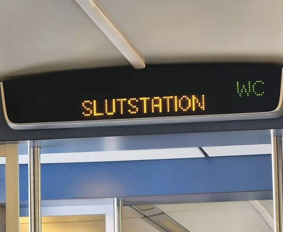 Train sign displaying "SLUTSTATION" and "WC" indicating the end of the line and restroom facilities