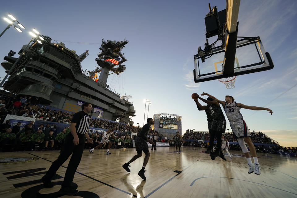Gonzaga forward Ben Gregg (33) and Michigan State guard A.J. Hoggard (11) reach for a rebound during the first half of the Carrier Classic NCAA college basketball game aboard the USS Abraham Lincoln in Coronado, Calif. Friday, Nov. 11, 2022. (AP Photo/Ashley Landis)