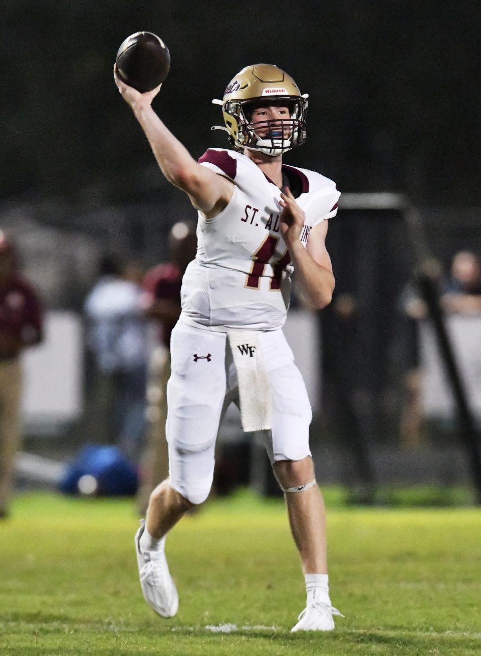 St. Augustine's quarterback Locklan Hewlett (11) targets a receiver during first-quarter action against Nease.