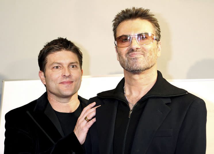 TOKYO, JAPAN - DECEMBER 15: British pop star George Michael and his partner Kenny Goss attend the Japanese Premiere of his film 