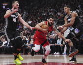 Toronto Raptors guard Fred VanVleet (23) tries to get between Sacramento Kings forward Domantas Sabonis (10) and forward Keegan Murray (13) during the first half of an NBA basketball game in Toronto on Wednesday, Dec. 14, 2022. (Nathan Denette/The Canadian Press via AP)