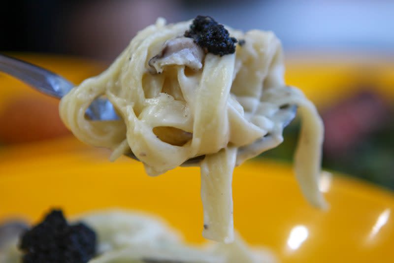 Image of truffle cheesewheel pasta