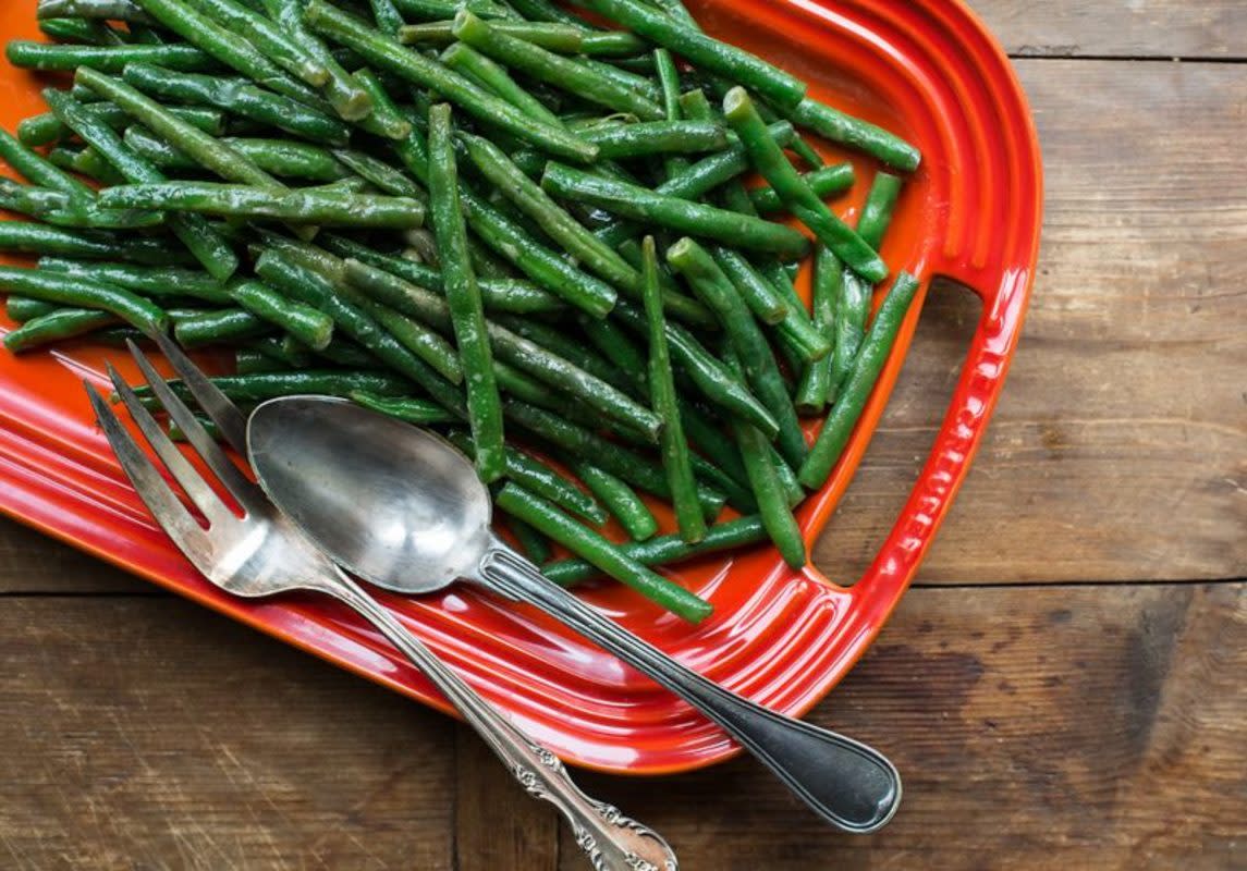 <p>Courtesy of Katie Workman</p><p>Honey, mustard and vinegar lend high notes to green beans. You can serve these warm or at room temperature, and this all comes together in less 10 minutes. 10 minutes!</p><p><strong>Get the recipe: </strong><strong><a href="https://themom100.com/recipe/honey-mustard-green-beans/" rel="nofollow noopener" target="_blank" data-ylk="slk:Honey Mustard Green Beans;elm:context_link;itc:0;sec:content-canvas" class="link rapid-noclick-resp">Honey Mustard Green Beans</a></strong></p>