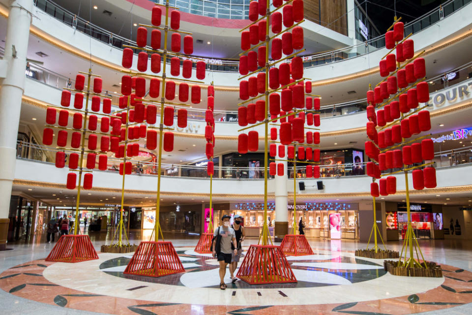 The towering decorations are lending a festive touch to the mall for Chinese New Year. — Picture by Firdaus Latif