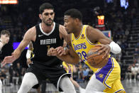 Los Angeles Lakers forward Rui Hachimura (28) drives against Memphis Grizzlies forward Santi Aldama (7) during the first half of an NBA basketball game Wednesday, March 27, 2024, in Memphis, Tenn. (AP Photo/Brandon Dill)