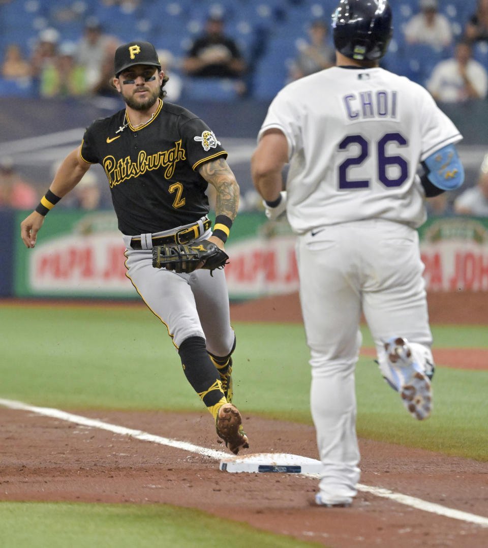 Pittsburgh Pirates' Michael Chavis (2) races to first base to force out Tampa Bay Rays' Ji-Man Choi (26) during the first inning of a baseball game Saturday, June 25, 2022, in St. Petersburg, Fla. (AP Photo/Steve Nesius)