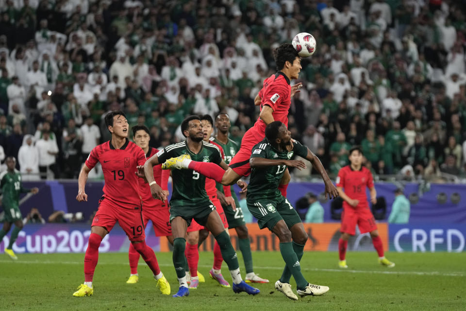 South Korea's Park Jin-seob go for a header during the Asian Cup round of 16 soccer match between Saudi Arabia and South Korea at Education City Stadium Al Rayyan, Qatar, Tuesday, Jan. 30, 2024. (AP Photo/Aijaz Rahi)