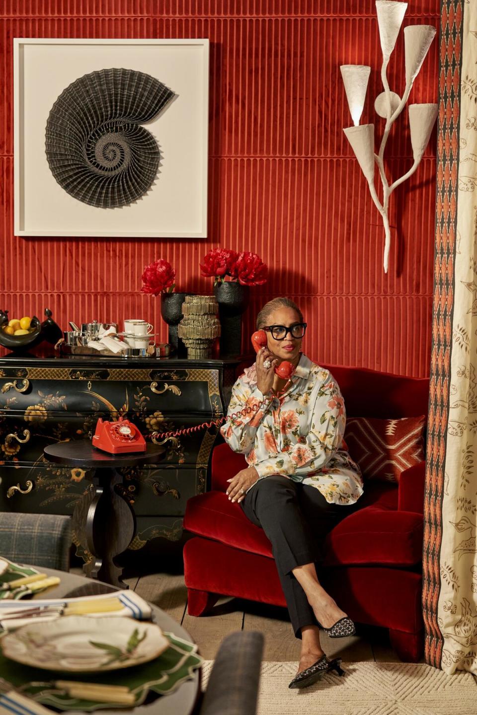 When that hotline blings, Joy Moyler takes the call in her deep red “Tatler” niche—a sumptuous spot to steal away after dinner and indulge in some juicy gossip 