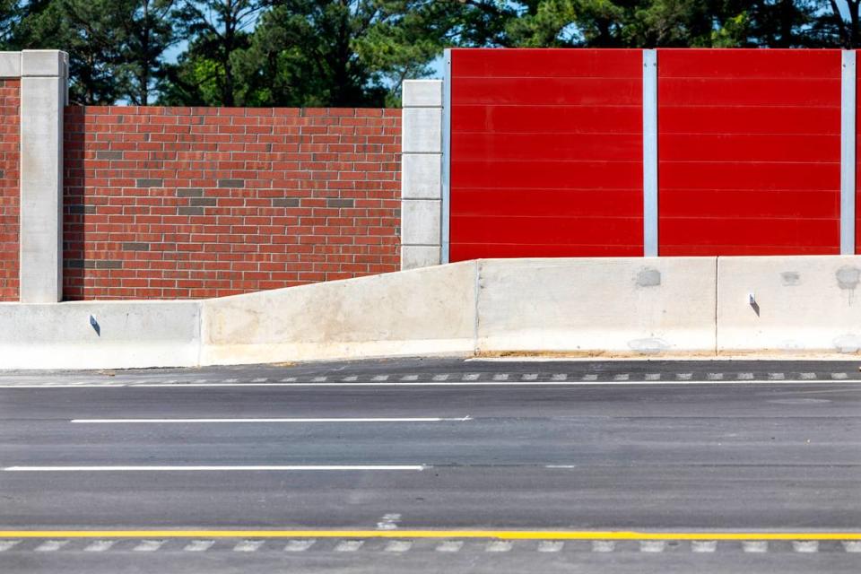 A brick noise reduction wall connects with a composite material that is used for noise reduction on bridges, due to the weight of bricks, on the newest section of N.C. 540 in southern Wake County on Tuesday, May 28, 2024.