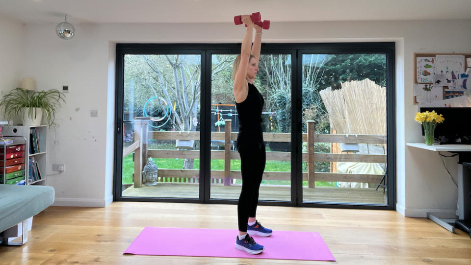 Maddy Biddulph performing a weighted squat thruster