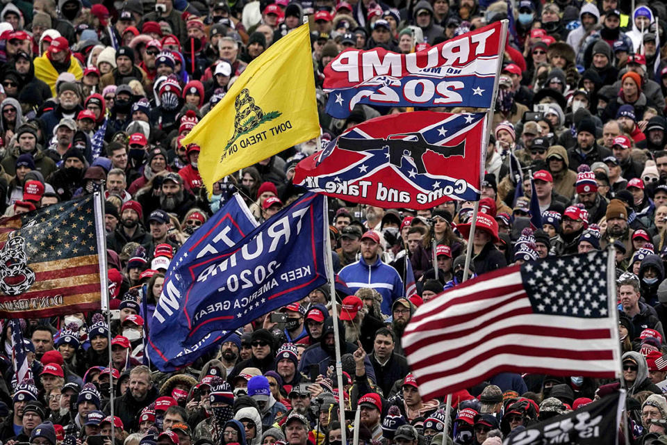 FILE - This photo from Wednesday Jan. 6, 2021, show supporters of President Donald Trump, with a Confederate-themed flag among others, listening to him speak as they rally in Washington before the deadly attack on the U.S. Capitol. In a nation founded on whiteness, experts share perspective on whether it can be discussed. If white people want the future to be different, said Rev. Susan Chorley, a Boston area pastor, they have to be willing to look at the past and the present. 