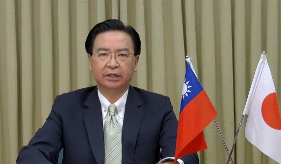 In this image from video released by Foreign Correspondents' Club of Japan, Taiwan Foreign Minister Joseph Wu attends a remote press conference with Foreign Correspondents Club of Japan in Tokyo, Thursday, June 3, 2021. Wu on Thursday said China is seeking political gains abroad in return for providing vaccines and other pandemic assistance, partly to increase pressure on Taiwan, which it claims as its own territory. (FCCJ via AP)