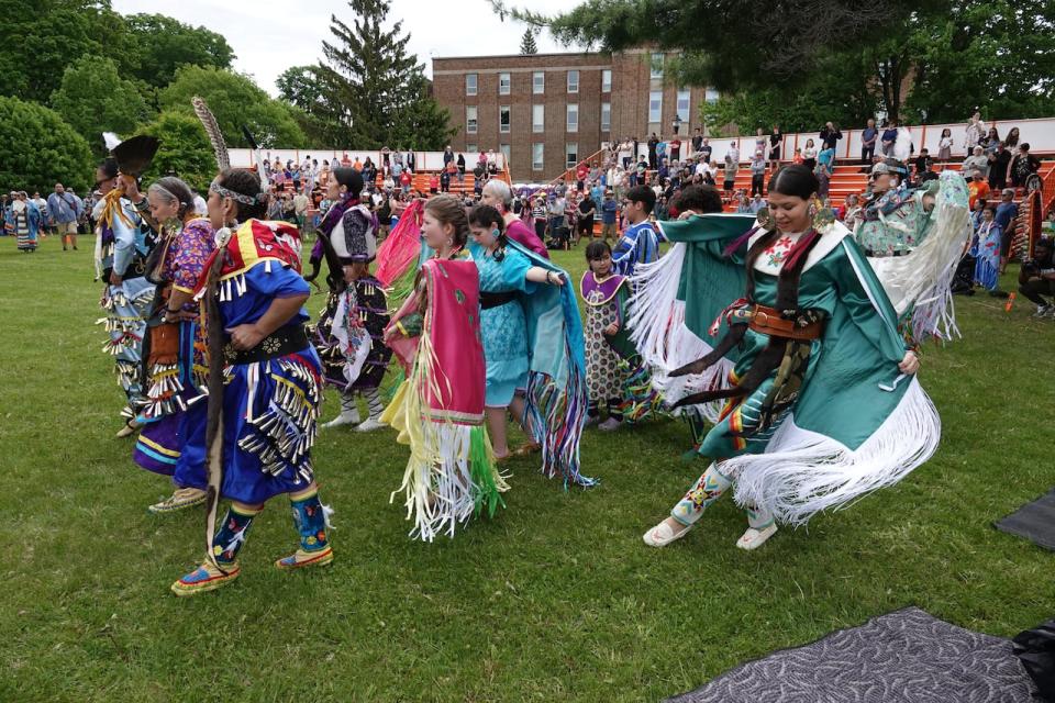 Kim Blanchet (right, in teal) and other participants in Powwow 101 dance at the Odawa Native Friendship Centre 45th annual powwow.