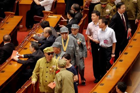 Attendees arrive for the ceremony to mark the 90th anniversary of the founding of the China's People's Liberation Army at the Great Hall of the People in Beijing, China August 1, 2017. REUTERS/Damir Sagolj