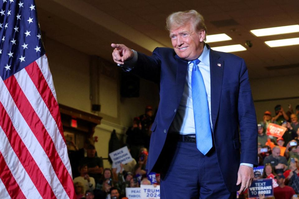 Former president Donald Trump gestures during a campaign rally in Claremont, New Hampshire on 11 November 2023 (REUTERS)