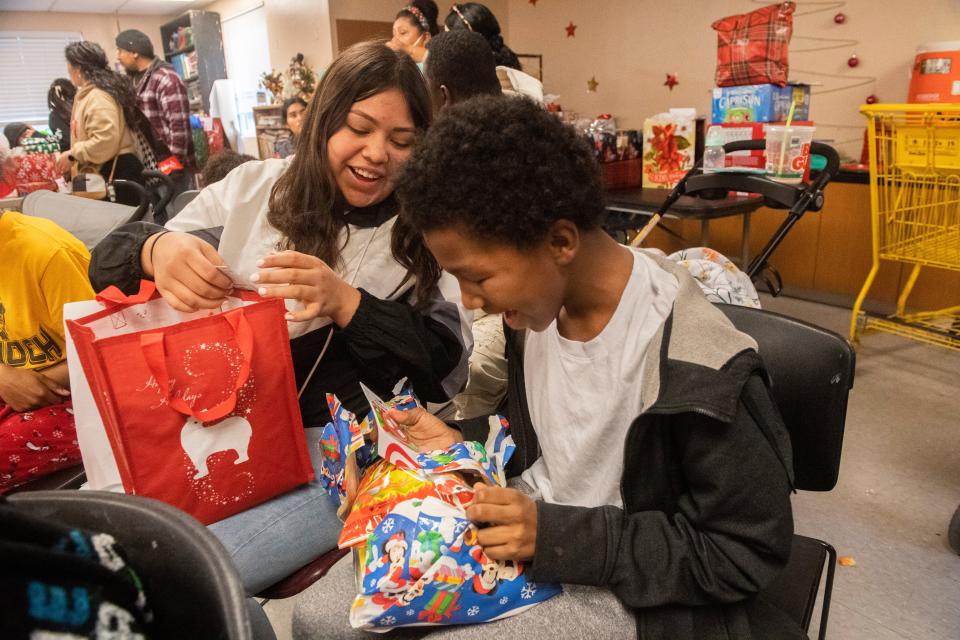Hellen Montes, 13, left, and Jaylin Taylor, 12, check out each others gifts they received at the CMC's annual Christmas party at the Stockton Shelter for the Homeless' family shelter on Thursday, Dec. 22, 2022. More than 100 presents were given out to children at the shelter as well as the Gospel Center Rescue Mission. "This is the one time of the year that the kids don't feel homeless" said shelter case worker Tiffany Monroy. "Everything is a blessing." 