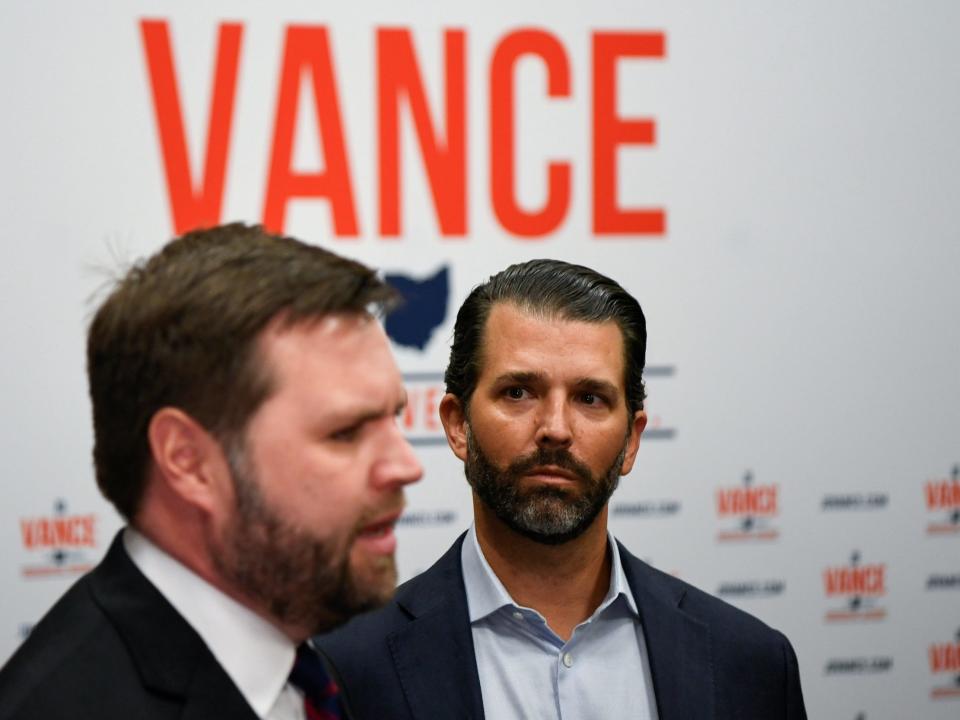 Donald Trump Jr. looks at JD Vance.