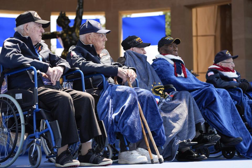 World War II veterans listen during a ceremony to mark the 80th anniversary of D-Day, Thursday, June 6, 2024, in Normandy. (AP Photo/Evan Vucci)