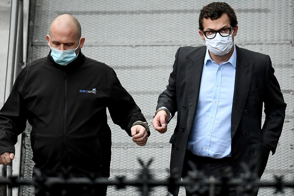 DUNDEE, SCOTLAND - FEBRUARY 23: Simon Bowes-Lyon, the the Earl of Strathmore, (R) leaves Dundee Sheriff Court in handcuffs after being sentenced to jail for 10 months for sexually assaulting a woman on February 23, 2021 in Dundee, Scotland. Bowes-Lyon, a distant cousin of Queen Elizabeth, pleaded guilty to forcing his way into the room of a guest at Glamis Castle, where he was hosting a function, and assaulting her. (Photo by Jeff J Mitchell/Getty Images)