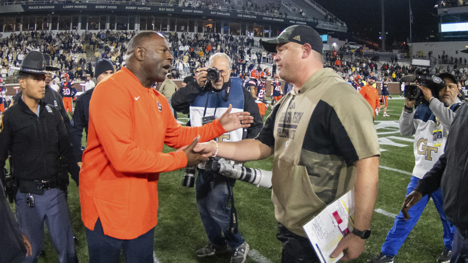 Georgia Tech coach Brent Key shakes hands with Syracuse coach Dino Babers after an NCAA college football game Saturday, Nov. 18, 2023, in Atlanta. (AP Photo/Hakim Wright Sr.)