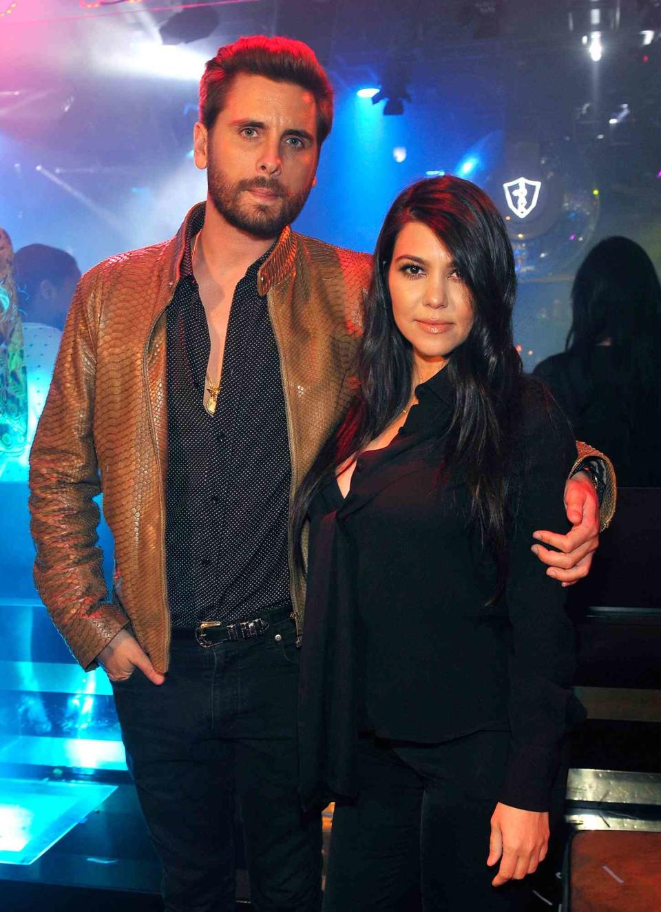 Scott Disick (L) and Kourtney Kardashian appear at 1 OAK Nightclub at The Mirage Hotel & Casino on February 21, 2015 in Las Vegas, Nevada