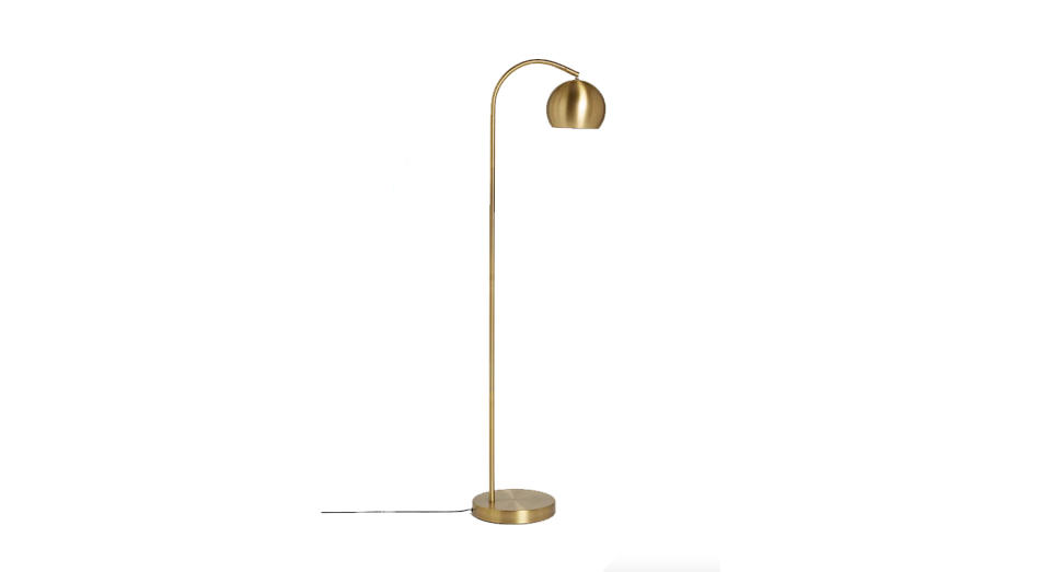 This chic metal lamp is designed with smaller homes in mind. 