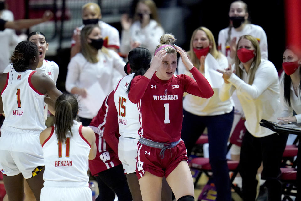 Wisconsin guard Estella Moschkau, center, reacts after being called for a violation against Maryland during the first half of an NCAA college basketball game, Thursday, Feb. 4, 2021, in College Park, Md. (AP Photo/Julio Cortez)