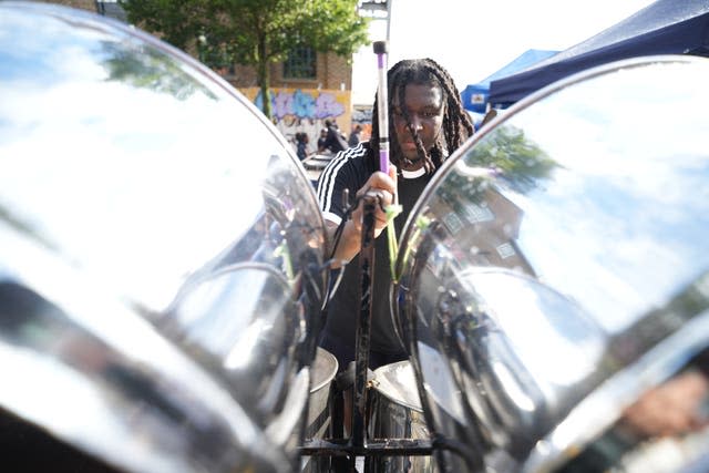 A man plays steel drums