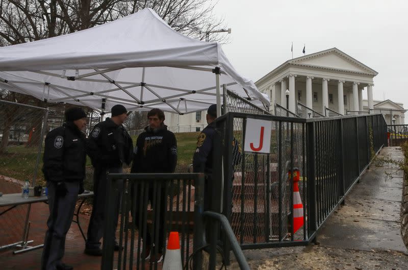 Law enforcement manage a security checkpoint to access the Virginia State Capitol grounds ahead of a gun rights advocates and militia members rally in Richmond, Virginia