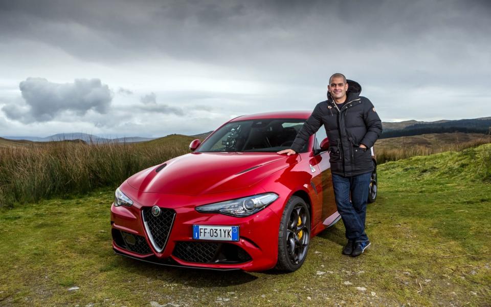 Chris Harris next to an Alfa Romeo Giulia Quadrifoglio in Wales 