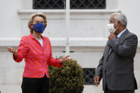 European Commission President Ursula von der Leyen is welcomed by Portuguese Prime Minister Antonio Costa at the Sao Bento palace in Lisbon, Monday, Sept. 28, 2020. (AP Photo/Armando Franca)