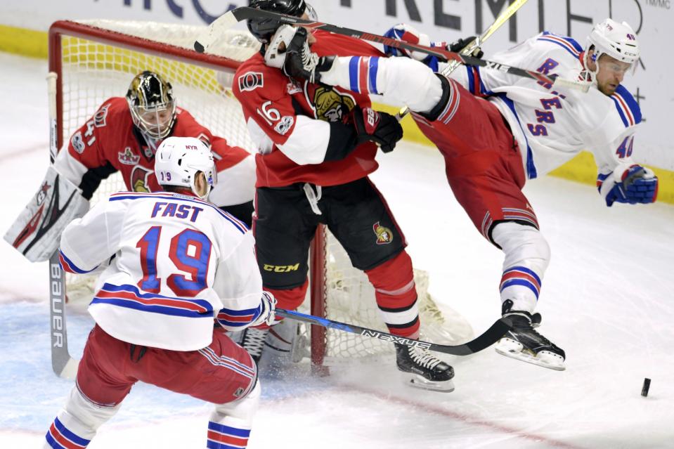 <p>Ottawa Senators left wing Clarke MacArthur (16) hits New York Rangers right wing Michael Grabner, right, as Senators goalie Craig Anderson (41) and Rangers right wing Jesper Fast (19) looks on during the first period in Game 5 in the second-round of the Stanley Cup playoffs in Ottawa on May 6, 2017. (Adrian Wyld/The Canadian Press/AP) </p>