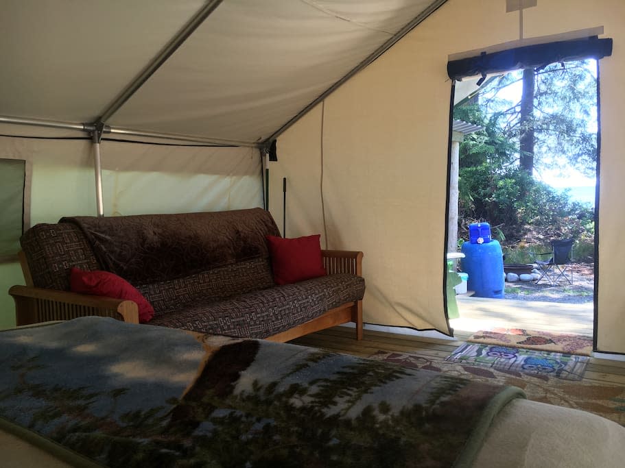 <p>Inside the tent, there’s a futon, great for lounging or for additional guests. (Airbnb) </p>