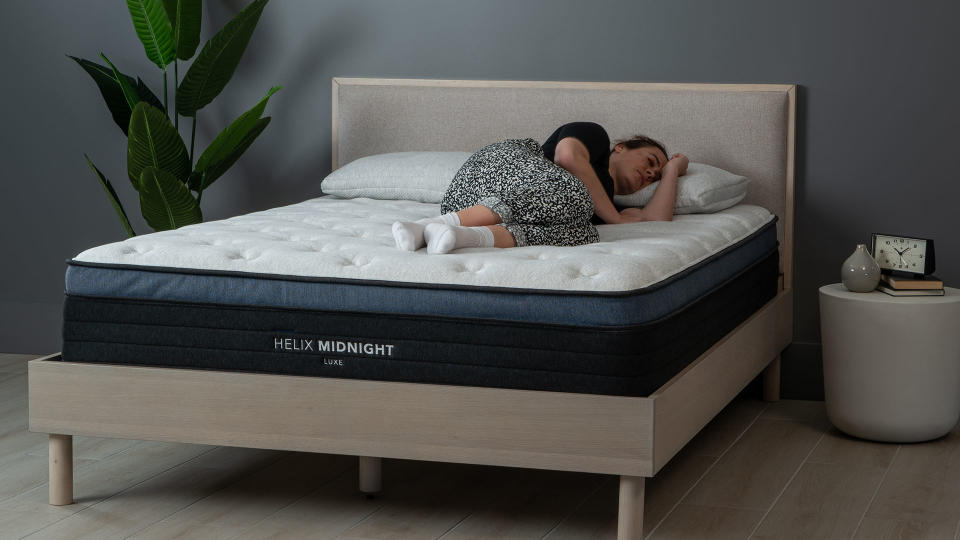 TechRadar sleep editor Ruth Hamilton lying on the Helix Midnight Luxe Mattress