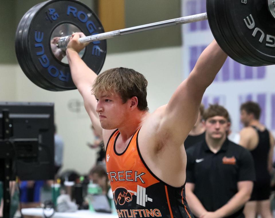 Spruce Creek High's Zachary Caron holds his lift as he waits for the judges signal to drop it, Wednesday March 27, 2024 during District 3-3A boys weightlifting meet at Flagler Palm Coast High School.