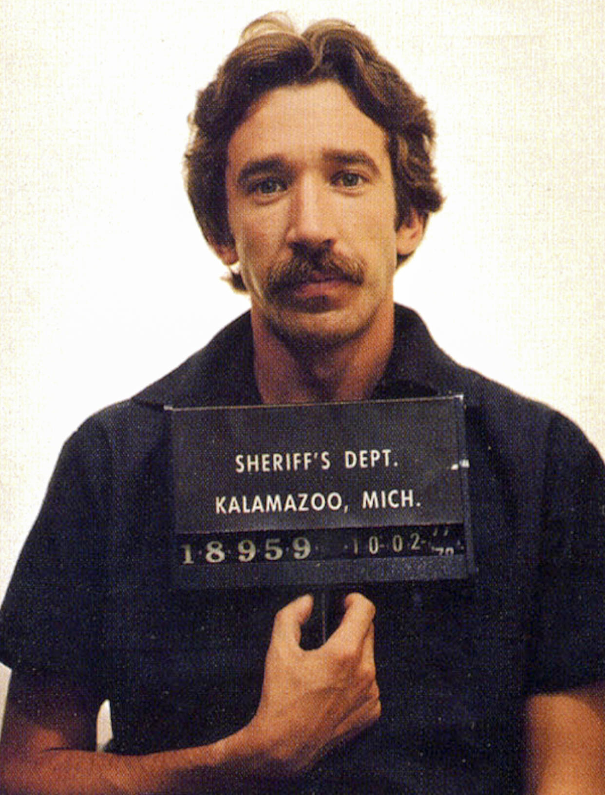 In this handout, American actor and comedian Tim Allen in a mug shot following his arrest for cocaine possession, Kalamazoo, Michigan, US, 2nd October 1978. (Photo by Kypros/Getty Images)