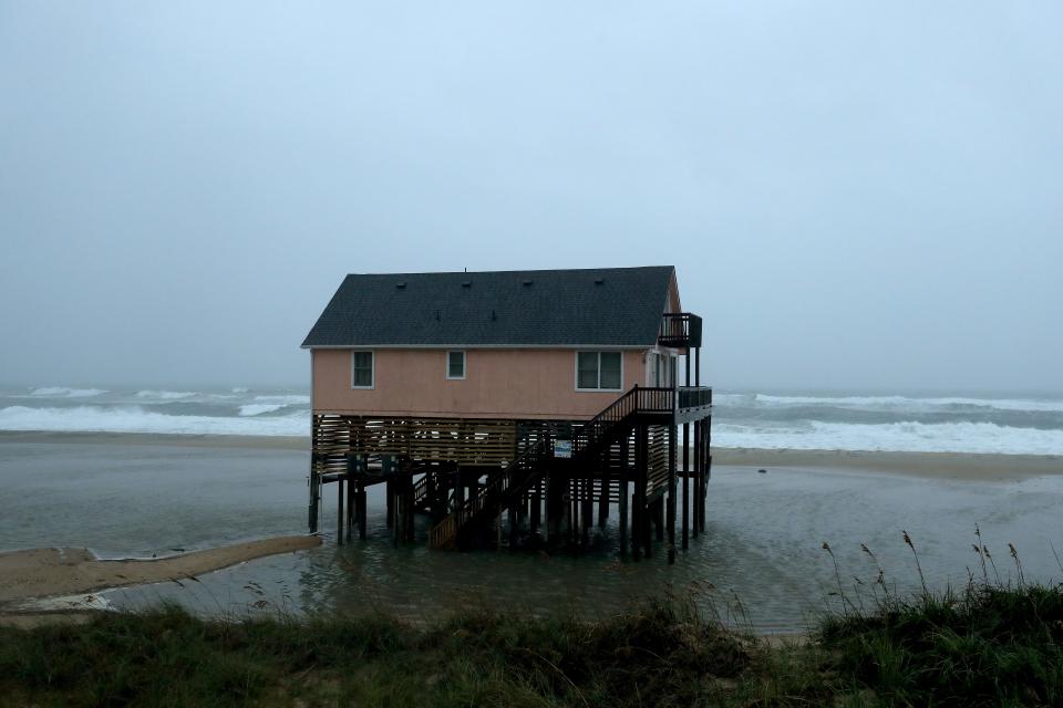 Water surrounds an ocean-front beach home as Hurricane Dorian hits the area, on September 6, 2019 in Nags Head, North Carolina.