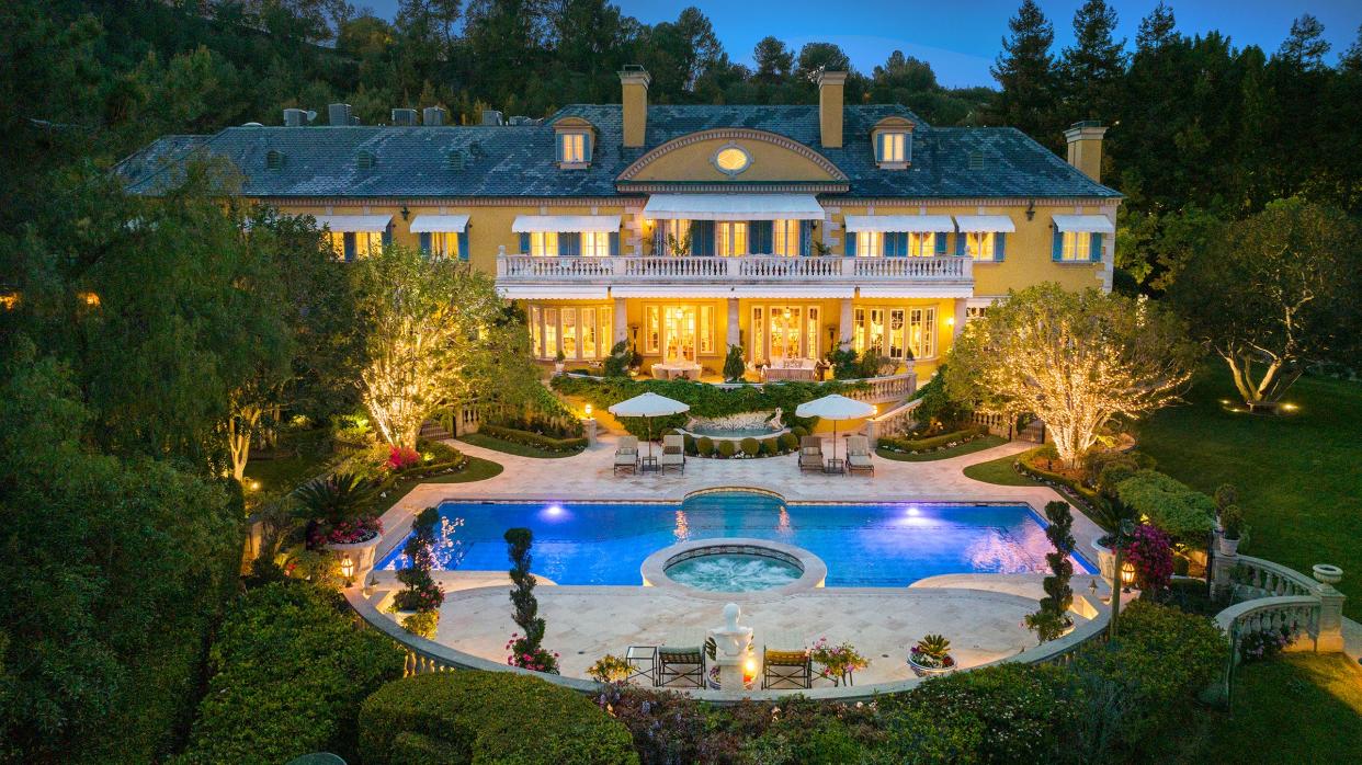 An expansive swimming pool is the focal point of the rear grounds at rocker Rod Stewart's California mansion, which is listed for sale at $77 million.