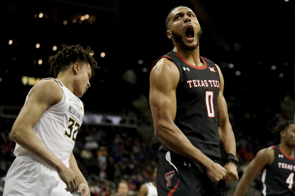 Texas Tech forward Kevin Obanor (0) celebrates after making a basket during the first half of an NCAA college basketball game against West Virginia in the first round of the Big 12 Conference tournament Wednesday, March 8, 2023, in Kansas City, Mo. (AP Photo/Charlie Riedel)